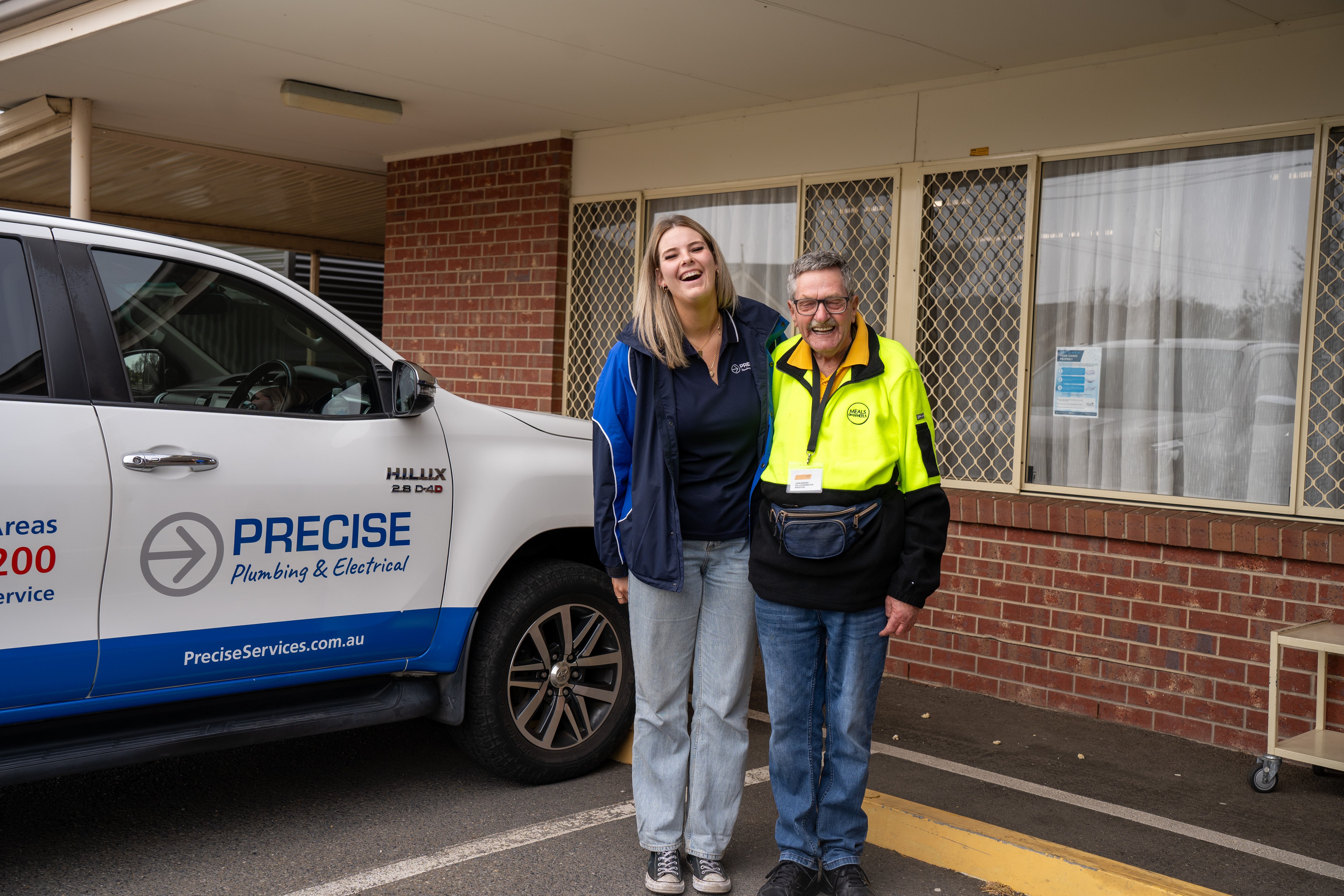 A team member with a happy customer